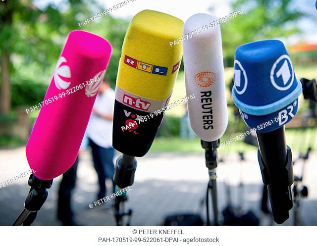 Colourful television microphones featuring the logos of media outlets Sat1 (L-R), RTL/ntv/VOX, Reuters and ARD/BR prior to a press conference in Schwarzenfeld