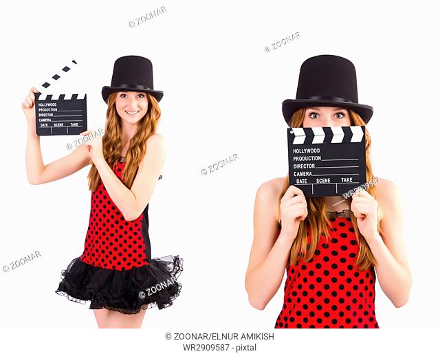 Pretty girl in red polka dot dress with movie board isolated on
