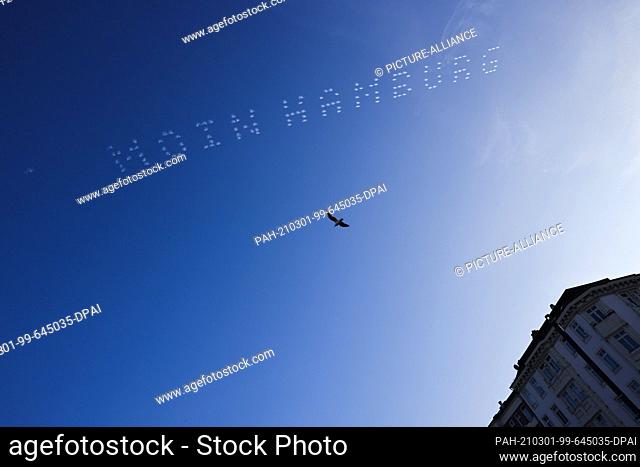 01 March 2021, Hamburg: The words ""Moin Hamburg"" can be read in the sky above the Reeperbahn. As part of an advertising campaign for a streaming service