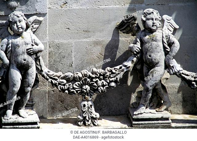 Putti with garland, detail from the facade of St Sebastian's Basilica, Acireale, Sicily, Italy
