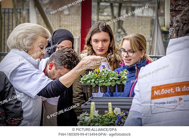 Princess Beatrix of The Netherlands during the annual volunteer day NL Doet at children day care 'Onder een Dak' for children with a handicap in Amersfoort
