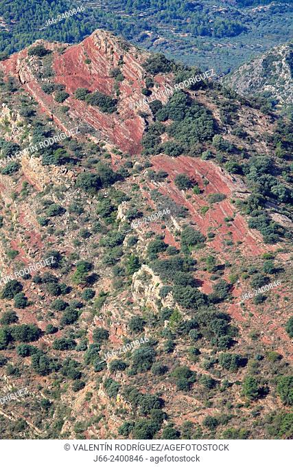 landscape in the natural park Sierra Espadán with reddish sandstone soil. Castellón. Spain