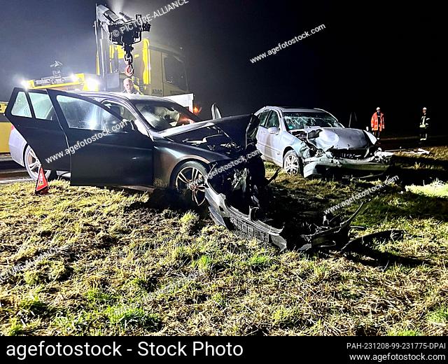 08 December 2023, Bavaria, Erlabrunn: Two cars are left on the side of the road after a head-on collision. An 83-year-old driver died in the accident on a state...