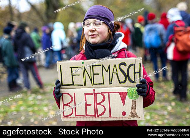 03 December 2022, Lower Saxony, Hanover: Demonstrators take part in a rally against upcoming clearing work for the expansion of the southern expressway (federal...