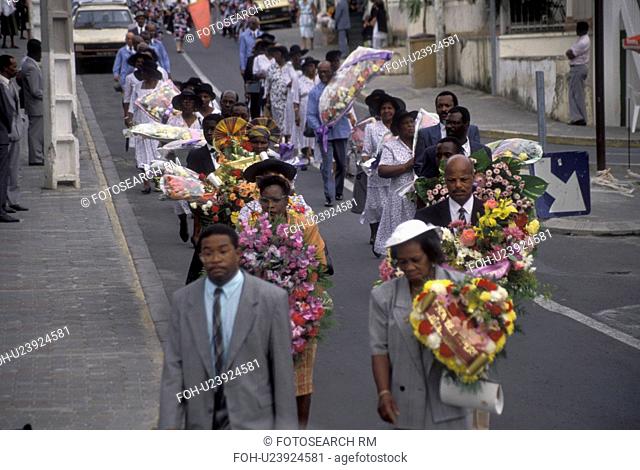 Guadeloupe, Caribbean, Caribbean Islands, Funeral procession on Main Street in Gosier on the island of Basse-Terre in Guadeloupe (a french department) The...
