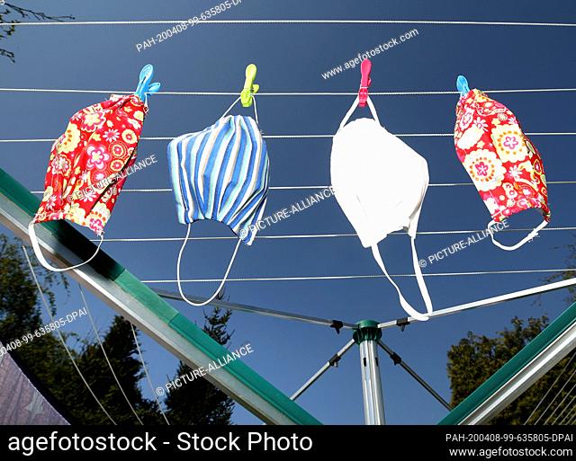08 April 2020, North Rhine-Westphalia, Mülheim: The 79-year-old pensioner Inge Vincents has hung up her self-sewn masks to dry after 60 degrees washing