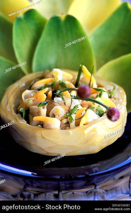 Scallops salad in an artichoke