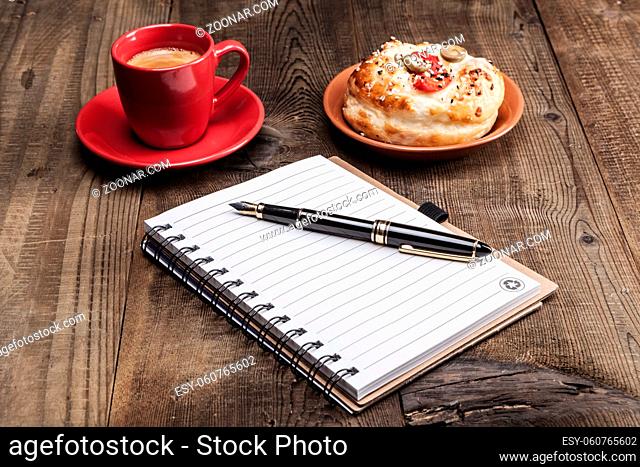 Coffe note and pen and delicious food
