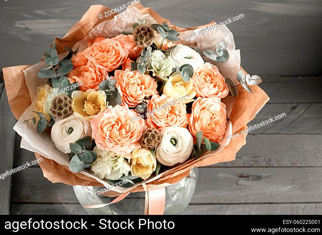 beautiful bouquet made of different flowers in glass vase. colorful color mix flower. place for text. copy space