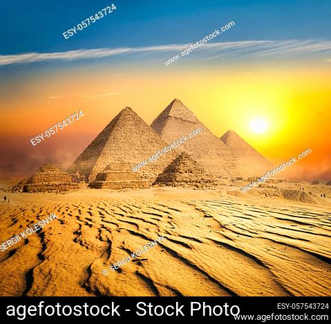Egyptian pyramids in sand desert and clear sky