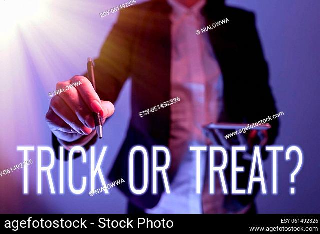 Writing displaying text Trick Or Treat, Concept meaning Halloween tradition consisting in asking for sweets Man With A Cellphone Pressing On A Fingerprint...