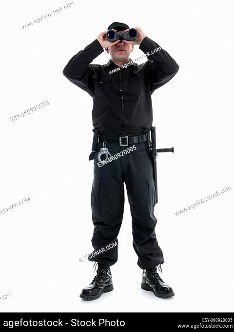 Security man wearing black uniform looking through binocular, shot on white