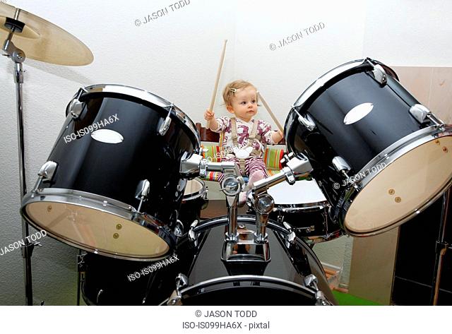 Baby girl playing drums