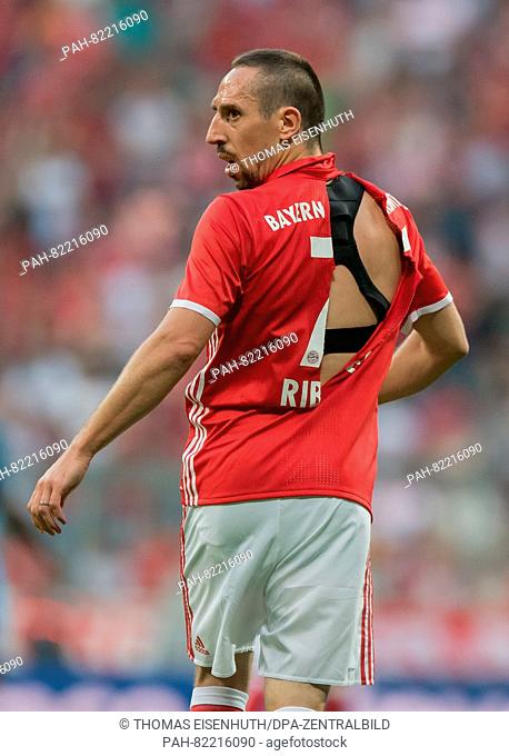 Munich's Franck Ribery seen with a ripped jersey during an international soccer friendly match between FC Bayern Munich and Manchester City at the Allianz Arena...