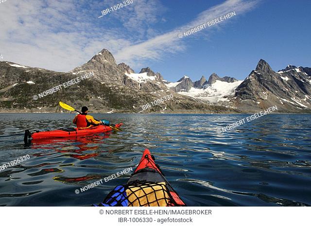 Seakayaks in front of icebergs in the Ikasartivaq-Fjord, East-Greenland, Greenland