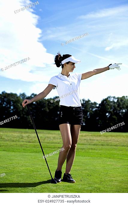 Woman playing golf on field, bright colorful vivid theme