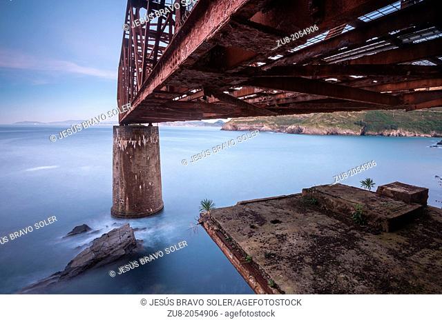 Photography taken from the base of the crane load. It is a cantilever crane that was used in the last century to load iron ore barges