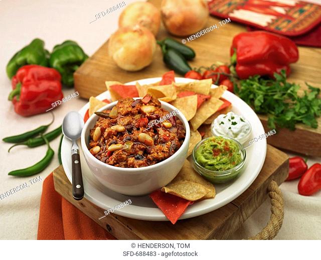 Bowl of Chili with Tortilla Chips, Guacamole and Sour Cream