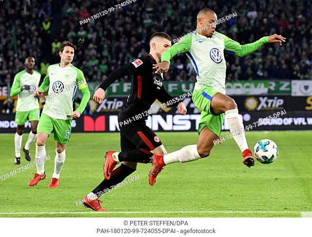 VfL Wolfsburg and Eintracht Frankfurt face off in a Bundesliga match in Wolfsburg, Germany, 20 January 2018. Wolfsburg's Marcel Tisserand (r) and Frankfurt's...
