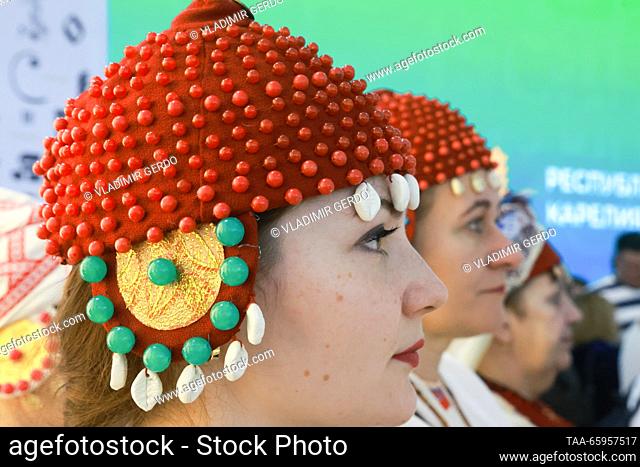 RUSSIA, MOSCOW - DECEMBER 21, 2023: A woman attends the opening of Karelia Republic Day at the Russia Expo international exhibition and forum at the VDNKh...