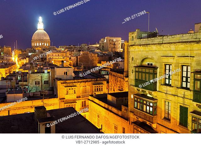 Overview at dusk of illuminated historic city of Valletta, Malta
