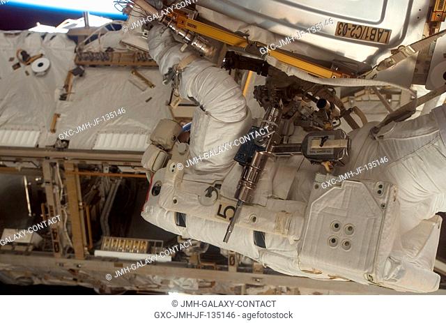 Astronaut Jim Reilly is photographed by a crewmate inside the spacecraft in the midst of a 7 hour, 58-minute spacewalk. Astronauts Reilly and John (Danny)...