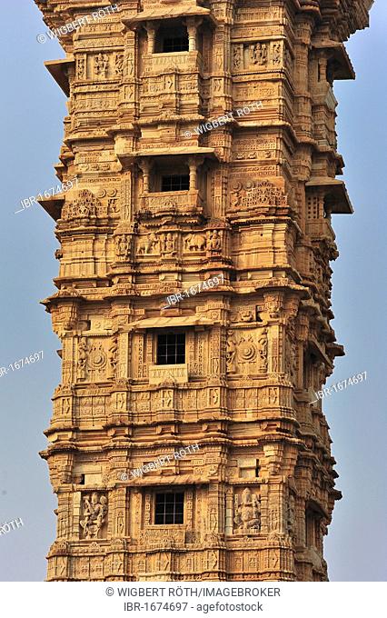 Partial view of the victory tower of the Rajput fortress, Chittorgarh Fort from the 15th century, scenes from the Ramayana and the Mahabharata are carved into...