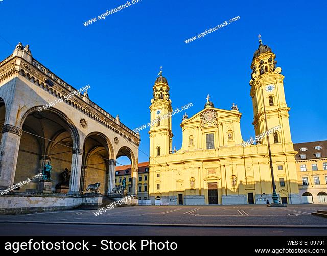 Germany, Bavaria, Munich, Theatine Church Of Saint Cajetan and Feldherrnhalle in deserted Odeonsplatz