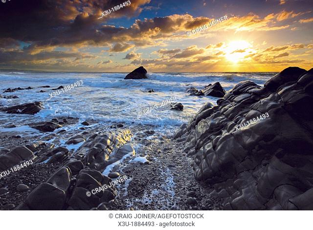 Sunset at Sandymouth Beach on the North Atlantic coast near Bude in Cornwall, England, United Kingdom