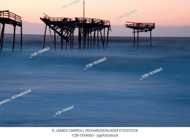 Sunrise on abandoned pier in North Carolina's Outer Banks USA