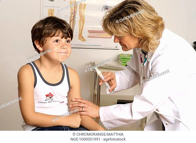 A little boy gets an injection