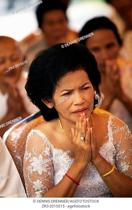 Mother of the bride at a buddhist wedding in a small village outside of Phnom Penh, Cambodia