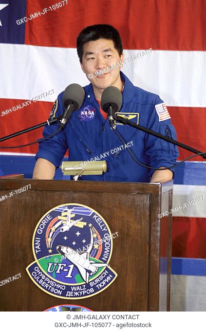 Astronaut Daniel M. Tani, STS-108 mission specialist, speaks from the podium in Hangar 990 at Ellington Field during the STS-108 and Expedition Three crew...