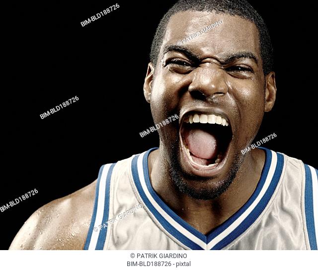 African basketball player shouting