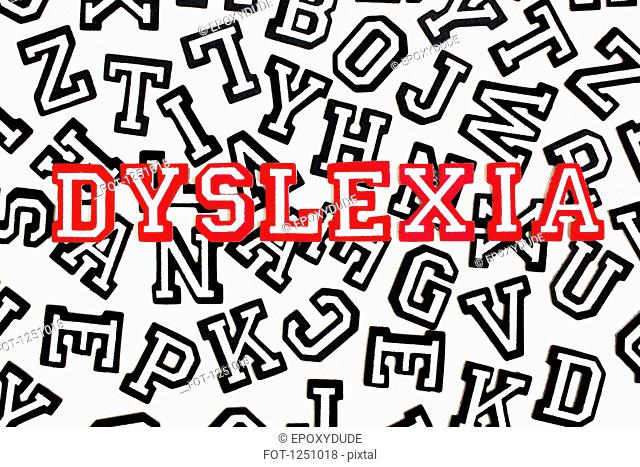 Red outlined varsity font stickers spelling Dyslexia on top of black outlined letters