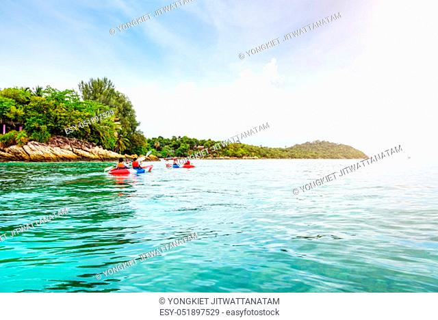 Tourist group are kayaking on the sea, travel by boat to see the beautiful nature landscape in the morning of summer at front the resort around Ko Lipe island
