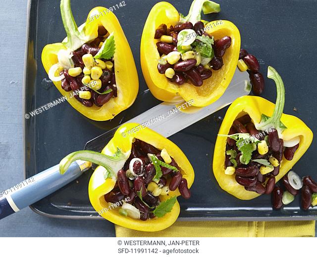 Yellow peppers filled with kidney beans and sweetcorn