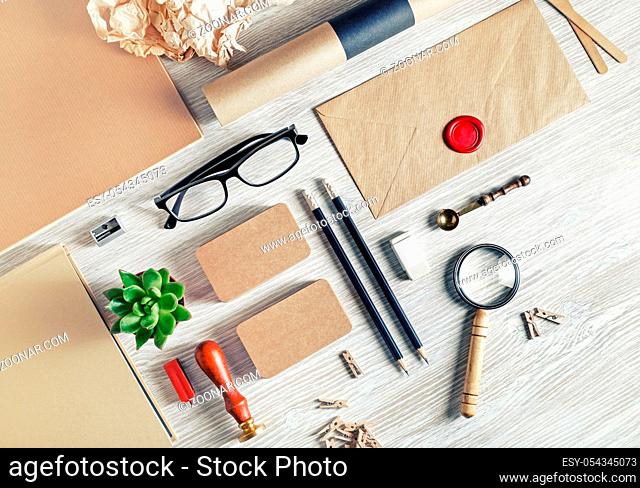 Blank stationery set on light wood table background. ID template. Mockup for branding identity for designers. Flat lay