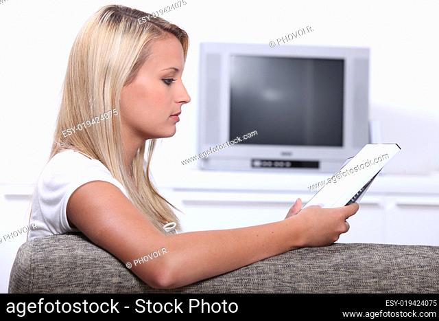 Young woman examining DVD boxes