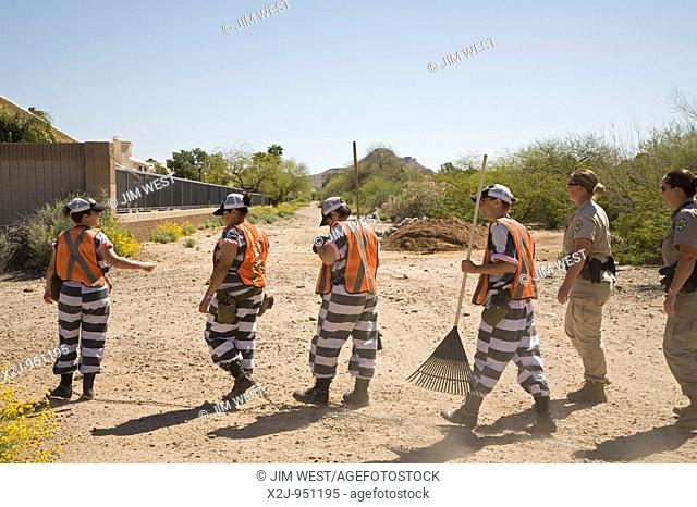 Phoenix, Arizona - A chain gang of woman inmates in Maricopa County jails is supervised by two female guards