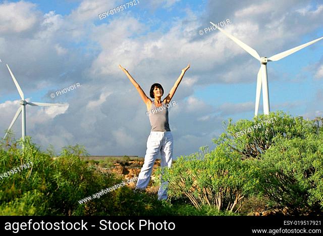 woman lifting arm near wind back