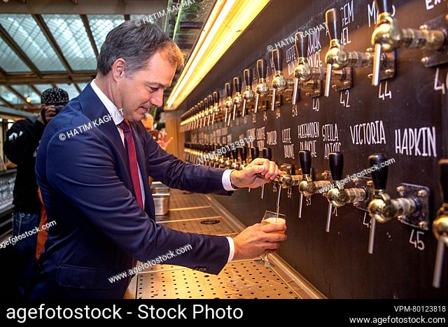 Prime Minister Alexander De Croo pours a beer from a multi tap at the launch of a new generic promotional campaign around Belgian beer