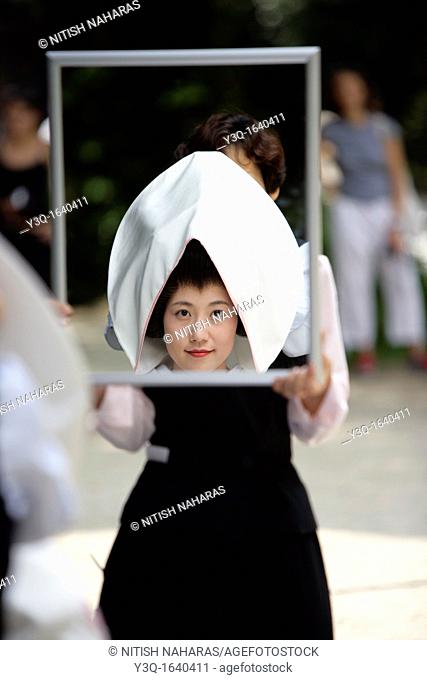 Japanese bride during bridal makeup at Meiji Jingu Shrine in Tokyo, Japan