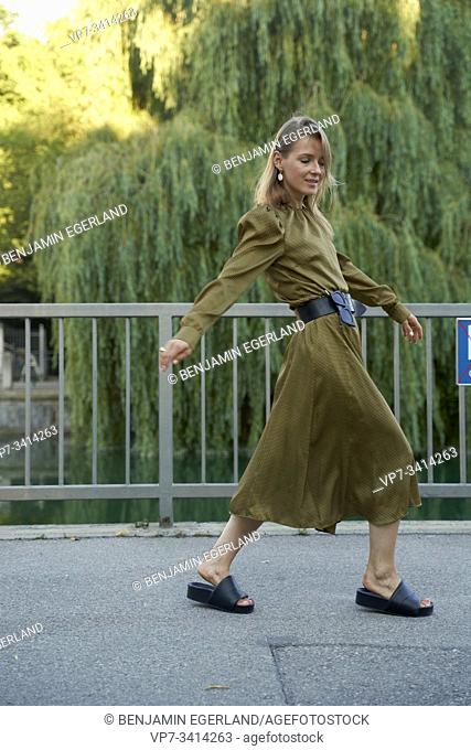 Woman walking. Munich, Germany