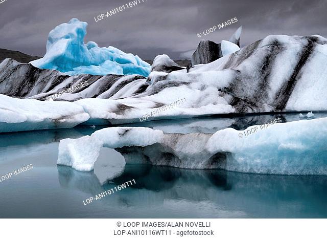 Icebergs in Jokulsarlon Glacial lagoon under a moody sky