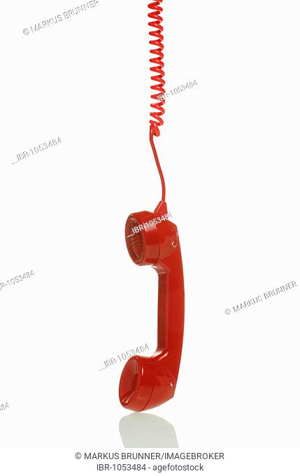 Red telephone receiver hanging down