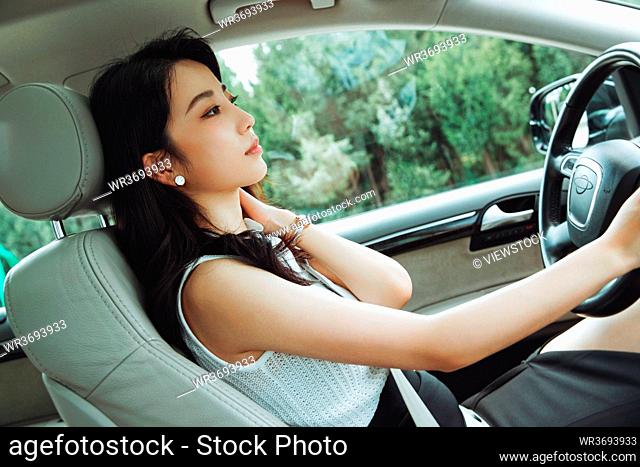 A beautiful young woman driving