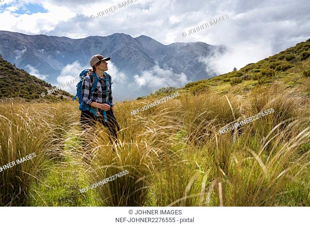 Young woman hiking in mountains