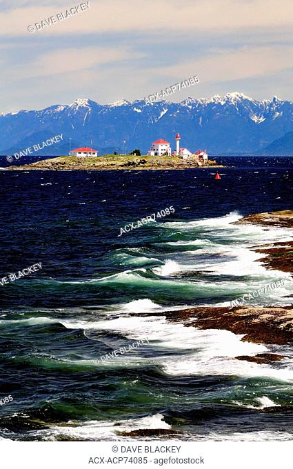 Entrance Island Lighthouse near Gabriola Island in the Strait of Georgia near Nanaimo, BC. The mountains in the background are the coastal mountains on the...