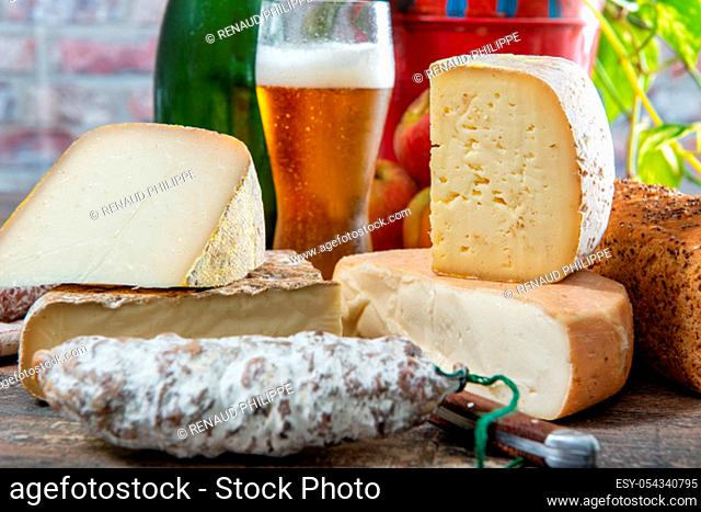 cheeses and Tomme de Savoie with a glass of beer, French cheese Savoy, french Alps France
